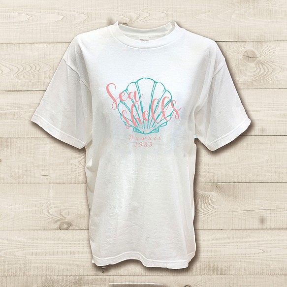 ハワイアンデザインTシャツ 貝がらのイラスト シェルのレトロな絵 貝殻のシルエット 半袖カットソー 1枚目の画像