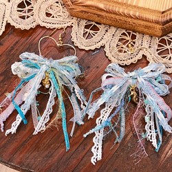 [ナンシー] &lt;海のハート&gt;さわやかな愛の刺繍ちょう結びタツノオトシゴパールシェルダングルピアス 1枚目の画像
