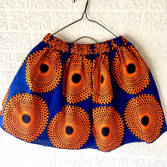 アフリカン キッズスカート(フリー120-140)ブルー/オレンジトライバルサークル柄パーニュキテンゲバティック一点物 1枚目の画像