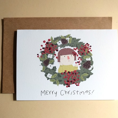 クリスマスサークルクリスマスカードを持つ少女/ 3へ カード・レター 