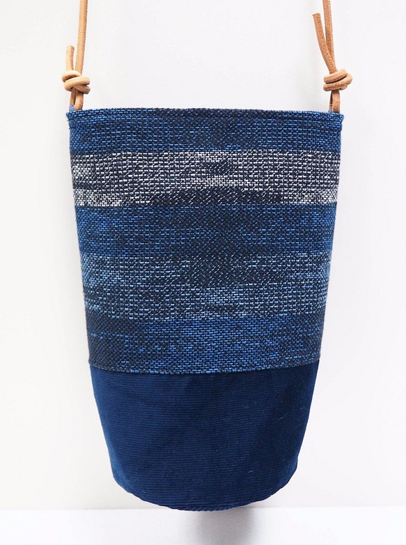 藍色織布水桶袋 第1張的照片