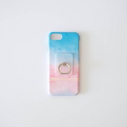 櫻花和藍天，智能手機套和戒指 第1張的照片