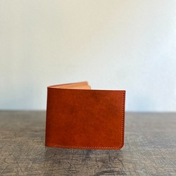 獨一無二的奢華皮革：採用 Lugateau 深橙色折疊緊湊型錢包 第1張的照片