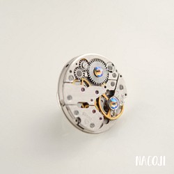 【購入不可、在庫はありません】時計仕掛けのバッジ【ブラックダイヤシマー】旧タイプ 1枚目の画像