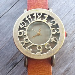 腕時計 <芸術的な彫刻レリーフ 本革 立体文字盤> 1枚目の画像