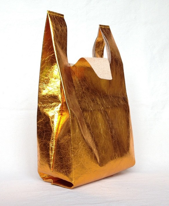 皮革黃金的方便袋M尺寸手提包 第1張的照片