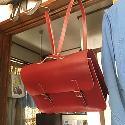 皮革酒紅色手提包袋包背包 第1張的照片
