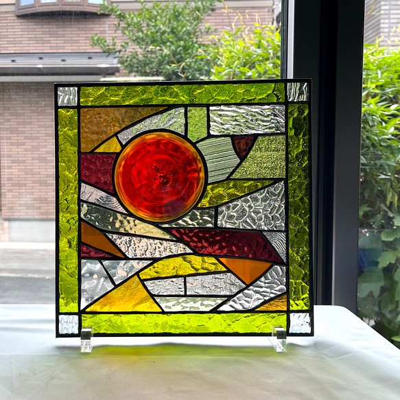 オレンジ色のロンデルとイエローグリーン系ガラスのコラボ　ステンドグラスパネル 1枚目の画像