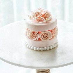 乳粉色花蛋糕環枕 第1張的照片
